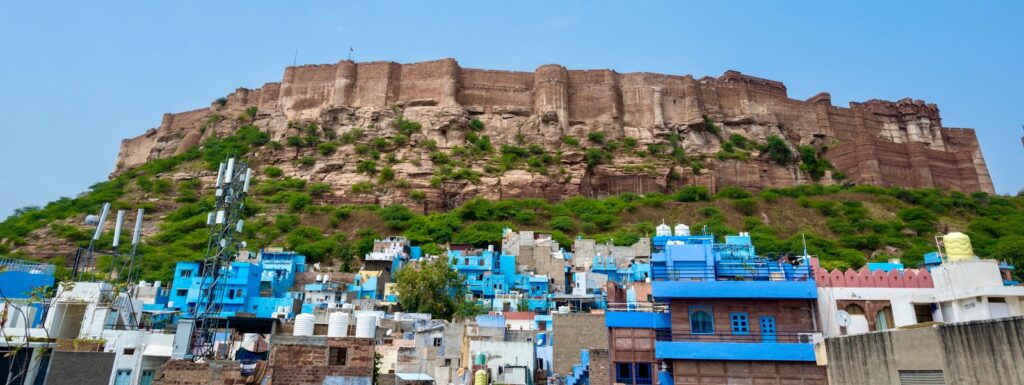 a very tall hill with a very tall building on top of it