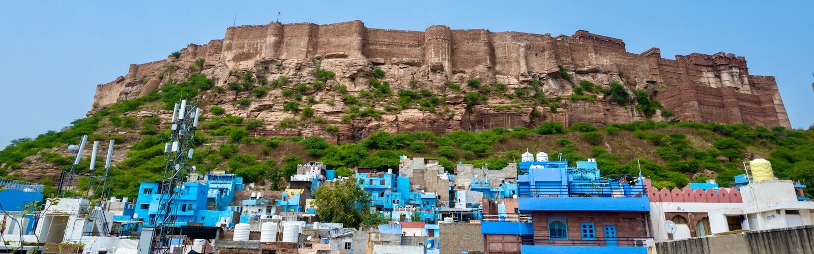 a very tall hill with a very tall building on top of it