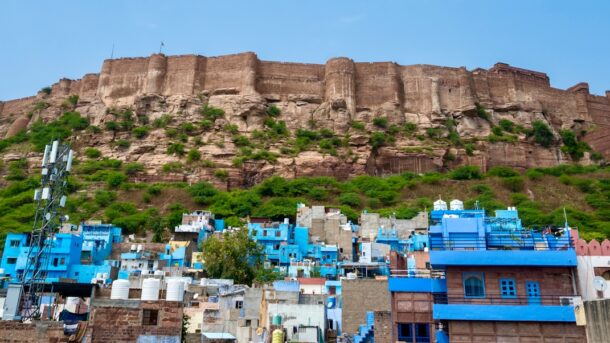 a very tall hill with a very tall building on top of it